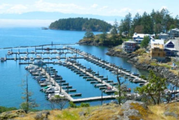 Fishing boats moored at Cheanuh Marina on the Sc’ianew (Beecher Bay) First Nation Reserve in East Sooke May 2019