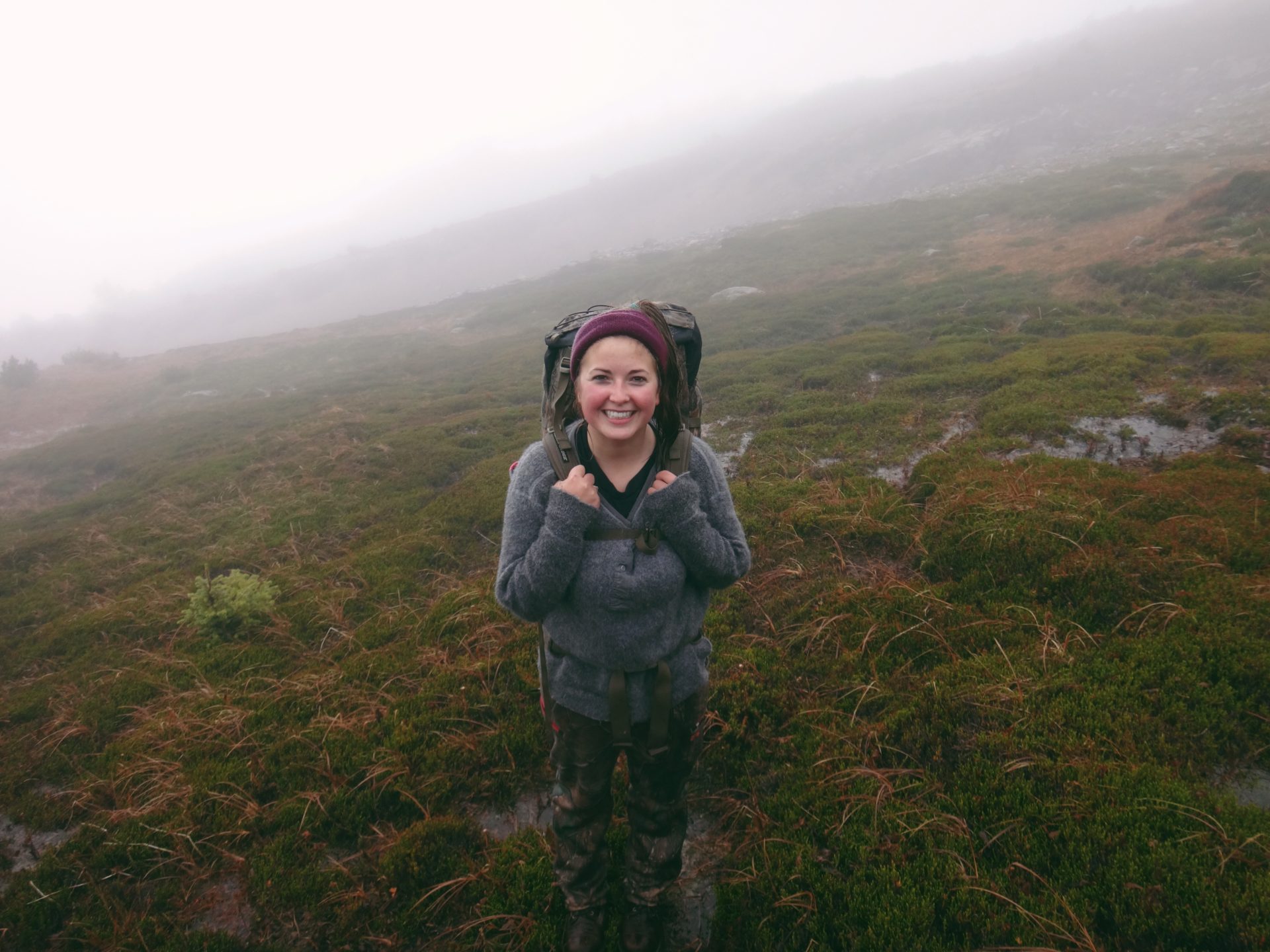 Despite the rain and fog, I was all smiles at the top of the mountain.