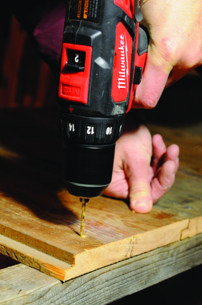 3A: Make the sides and roof from either boards or plywood. Here, salvaged siding boards are pre-drilled before securing to the frame with screws. 