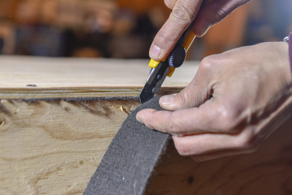 9.	Trim the excess carpet flush with the edge of the drawer using a utility knife. 