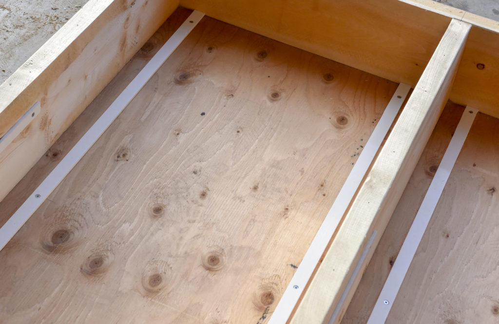 10.	Puckboard was cut into one-inch strips and installed in the fram as drawer glides. 