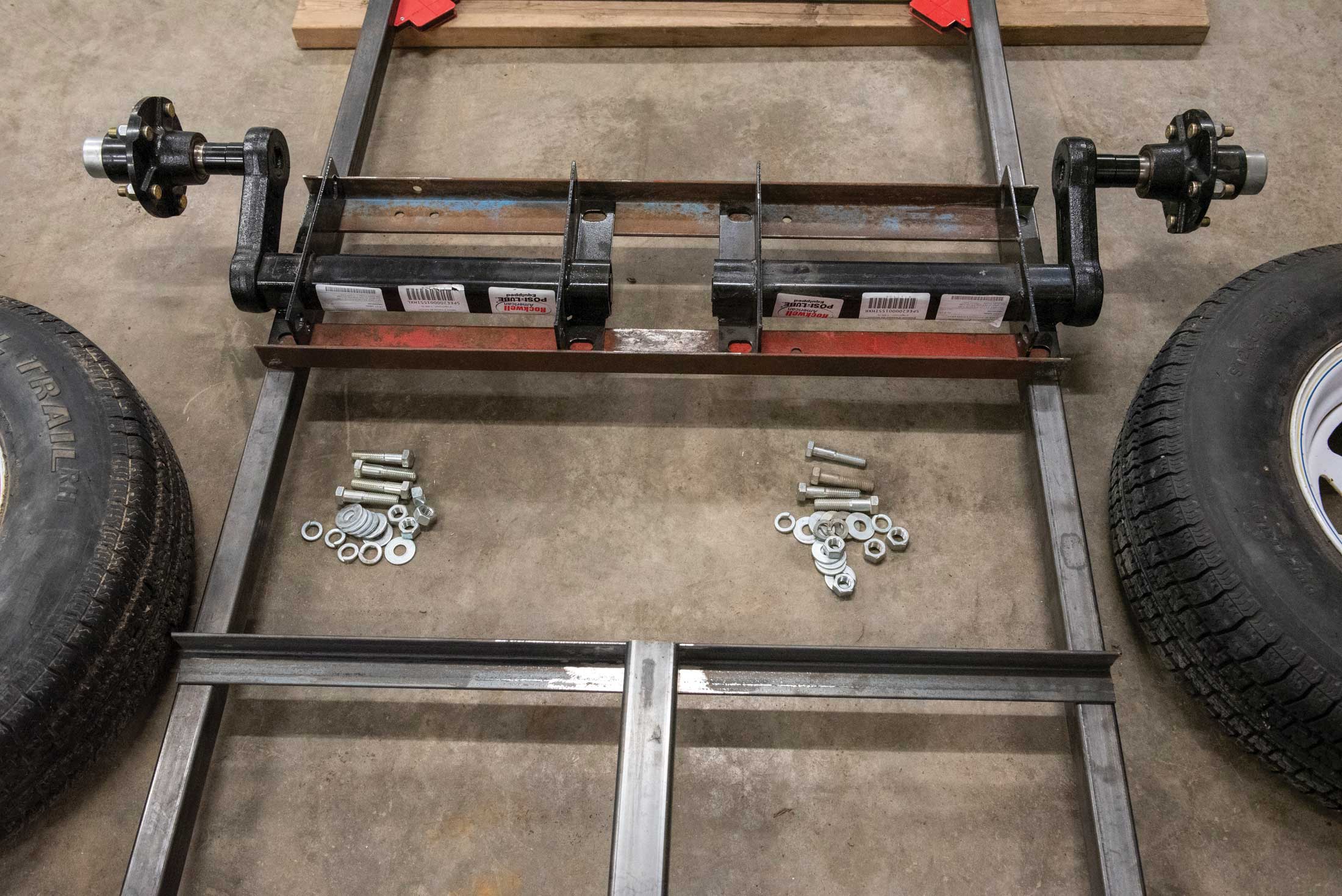 Step 7, assembly: The axel assemblies were bolted onto the frame supports, followed by tire installation.