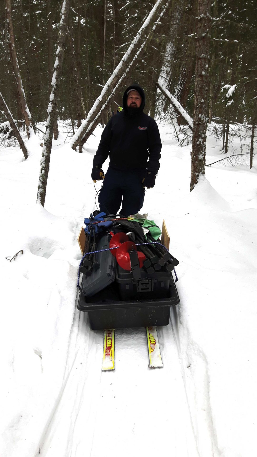 A sled affixed to skis is a great vehicle for getting your fishing gear out on the ice.