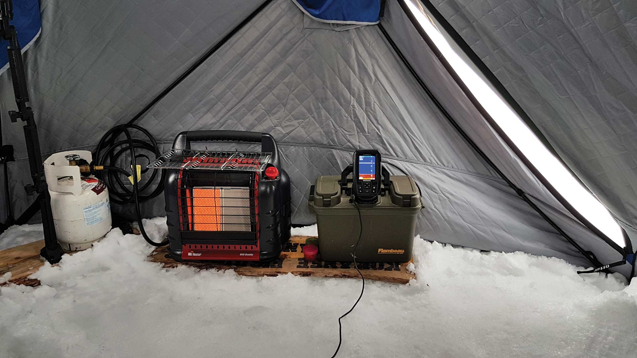 A tent, a heater and a fish finder can make ice fishing easier and more enjoyable.