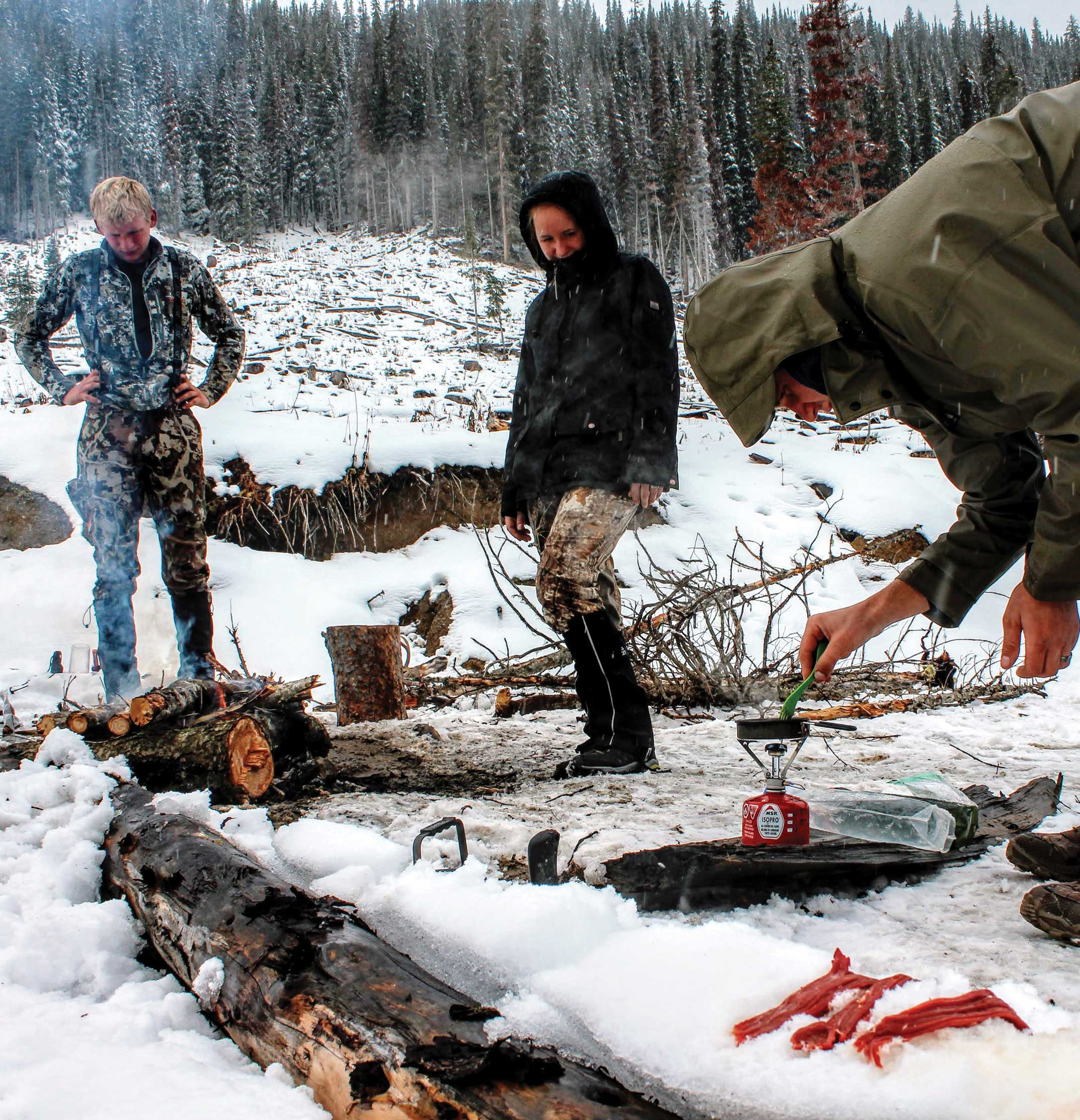 Teamwork makes the dream work, and hot food helps everyone forget a chilly day afield.