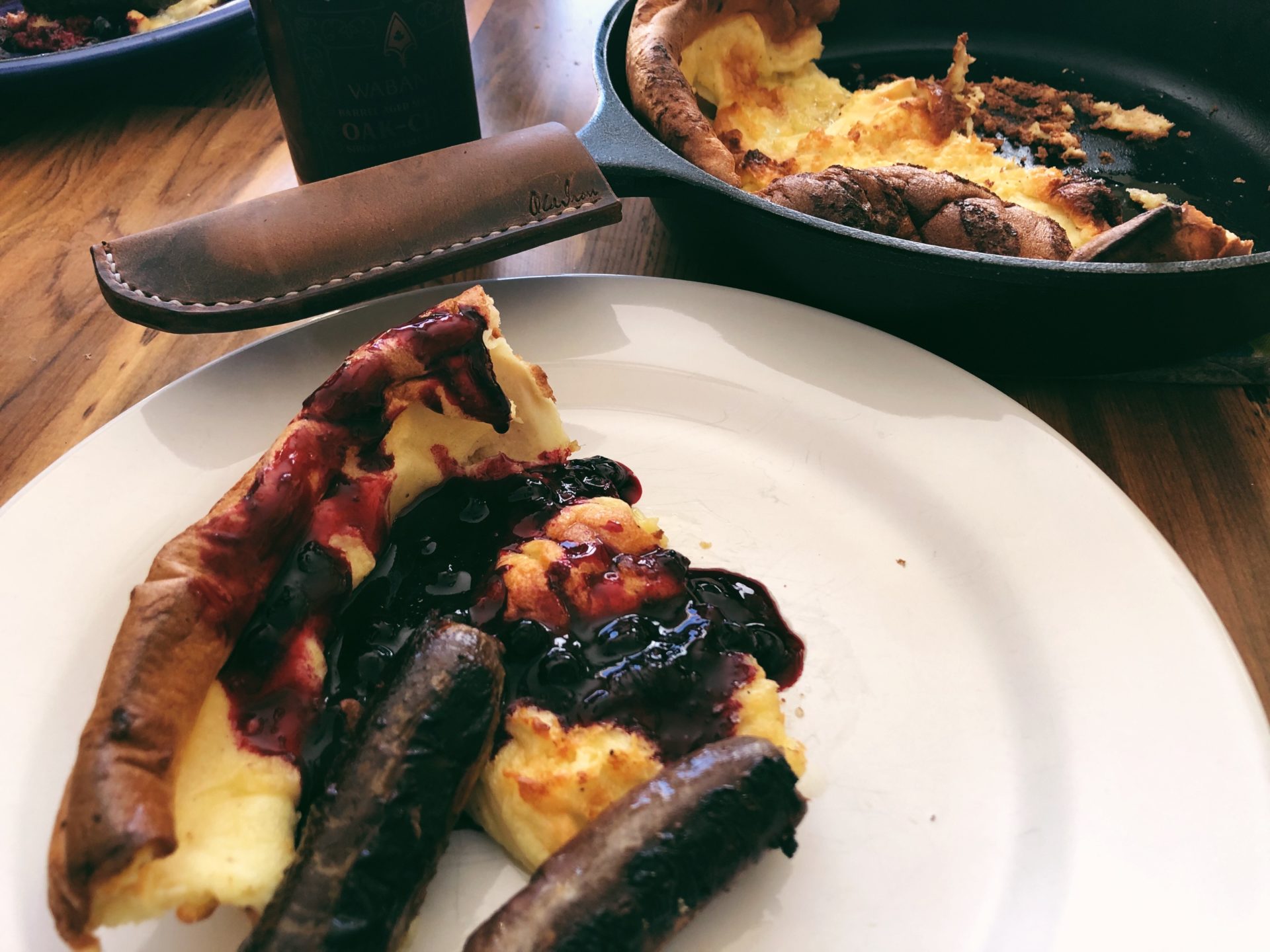 Cast Iron Dutch Baby With Huckleberry Sauce. Credit: Raeanne O’Meara.