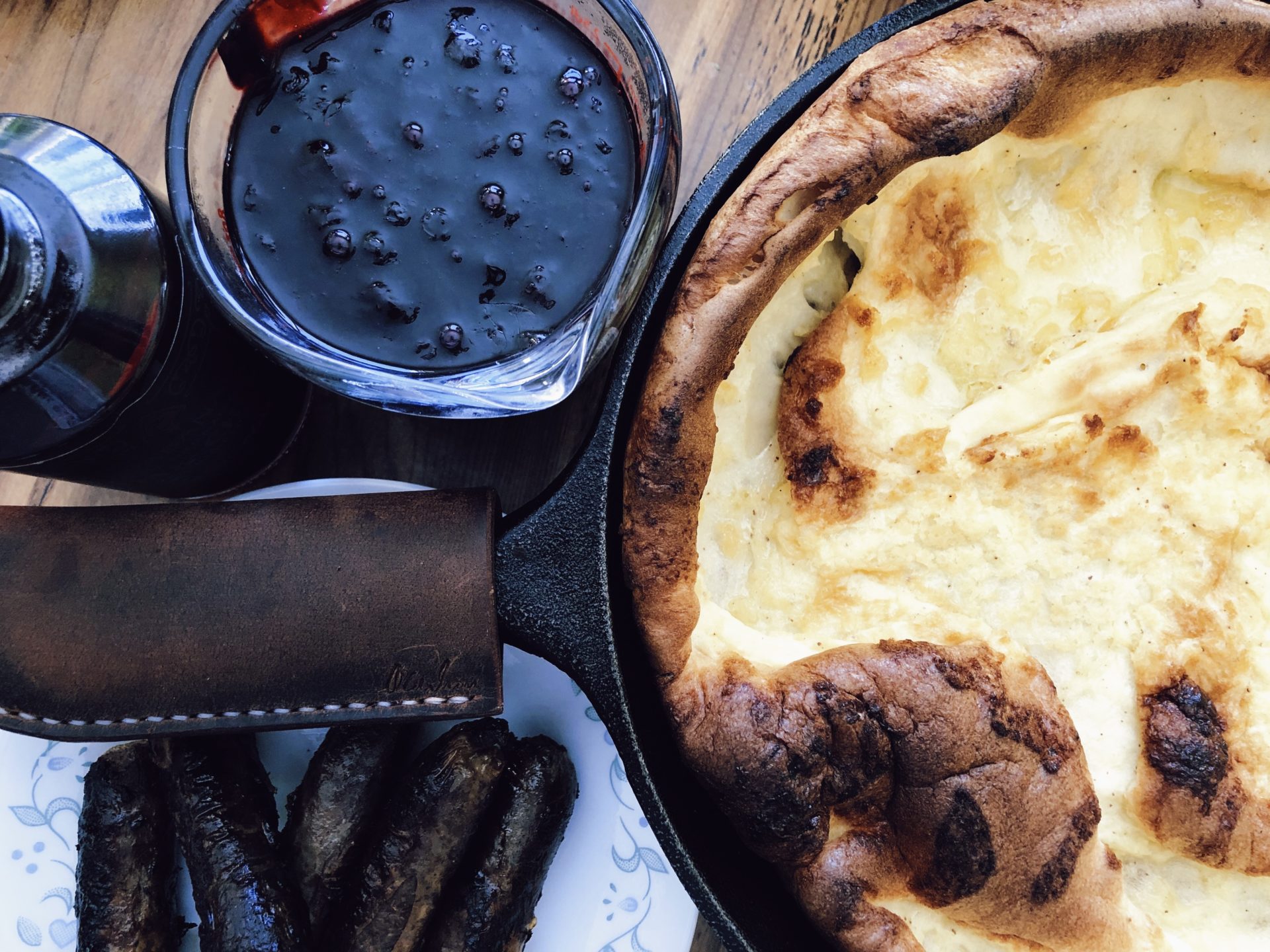 Cast Iron Dutch Baby With Huckleberry Sauce. Credit: Raeanne O’Meara.