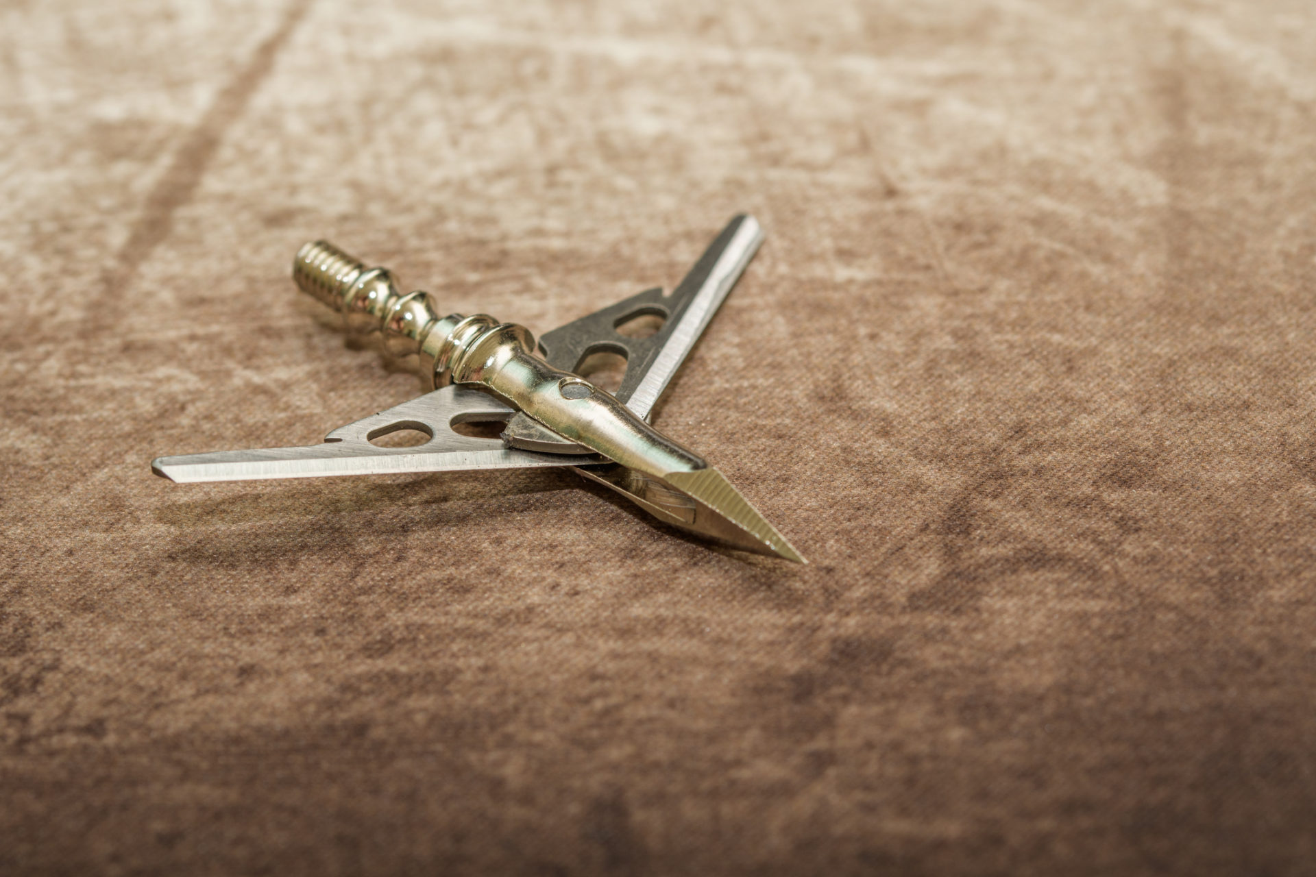 Mechanical broadhead with blades in open position.