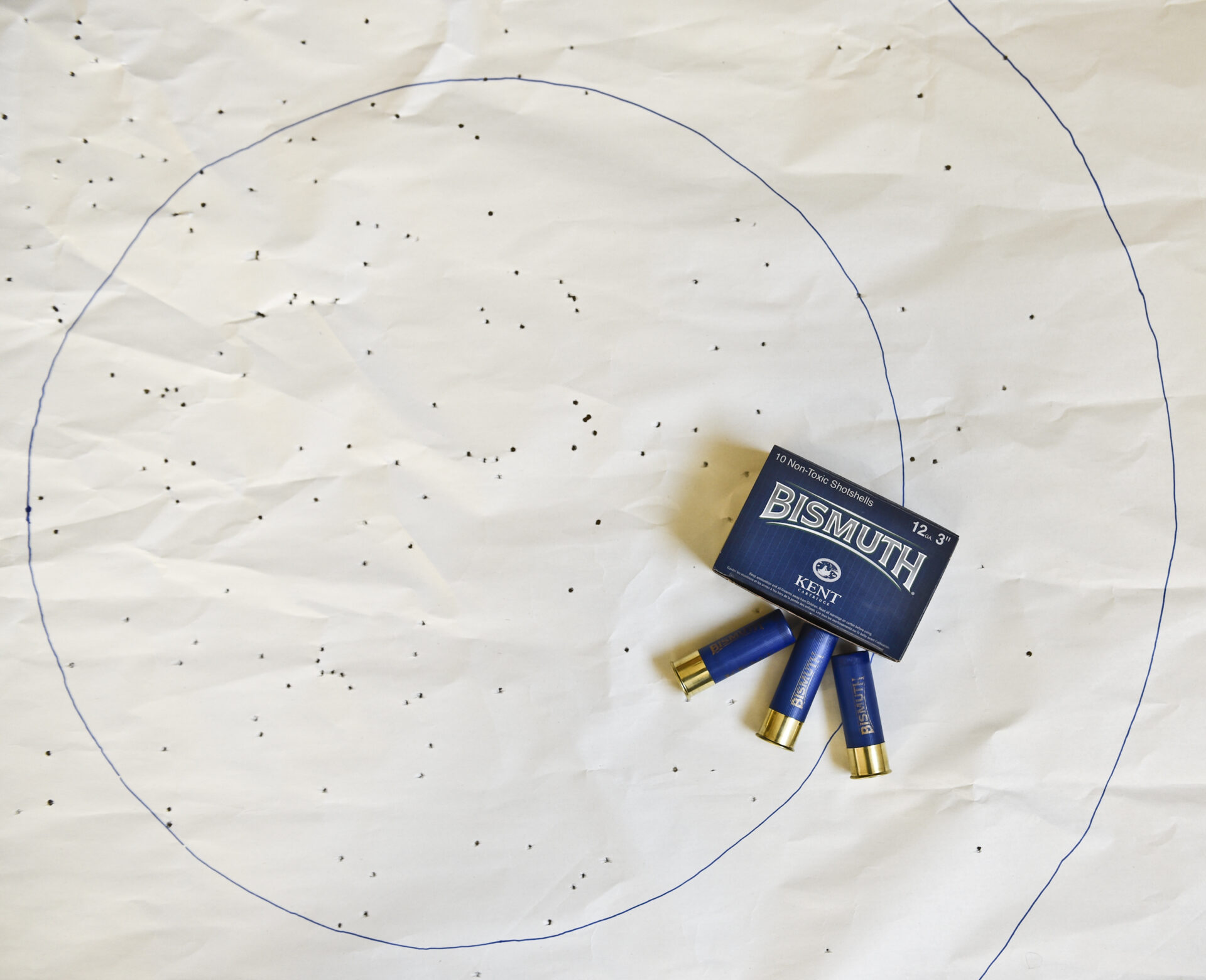 A patterning target with 20-inch and 30-inch circles marked on it. To calculate pattern density, divide the number of hits by the total number of pellets per shotshell.